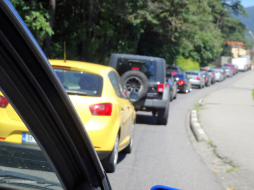 In traffic following the yellow car